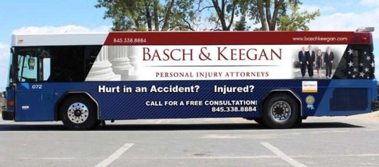 Basch & Keegan advertising poster on a city bus
