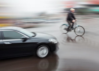 bicyclist with vehicle