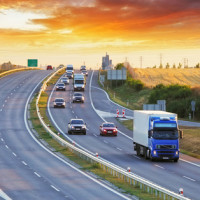 cars and big rigs on highway