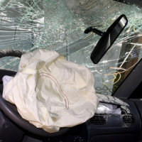 Deployed airbag and cracked windshield