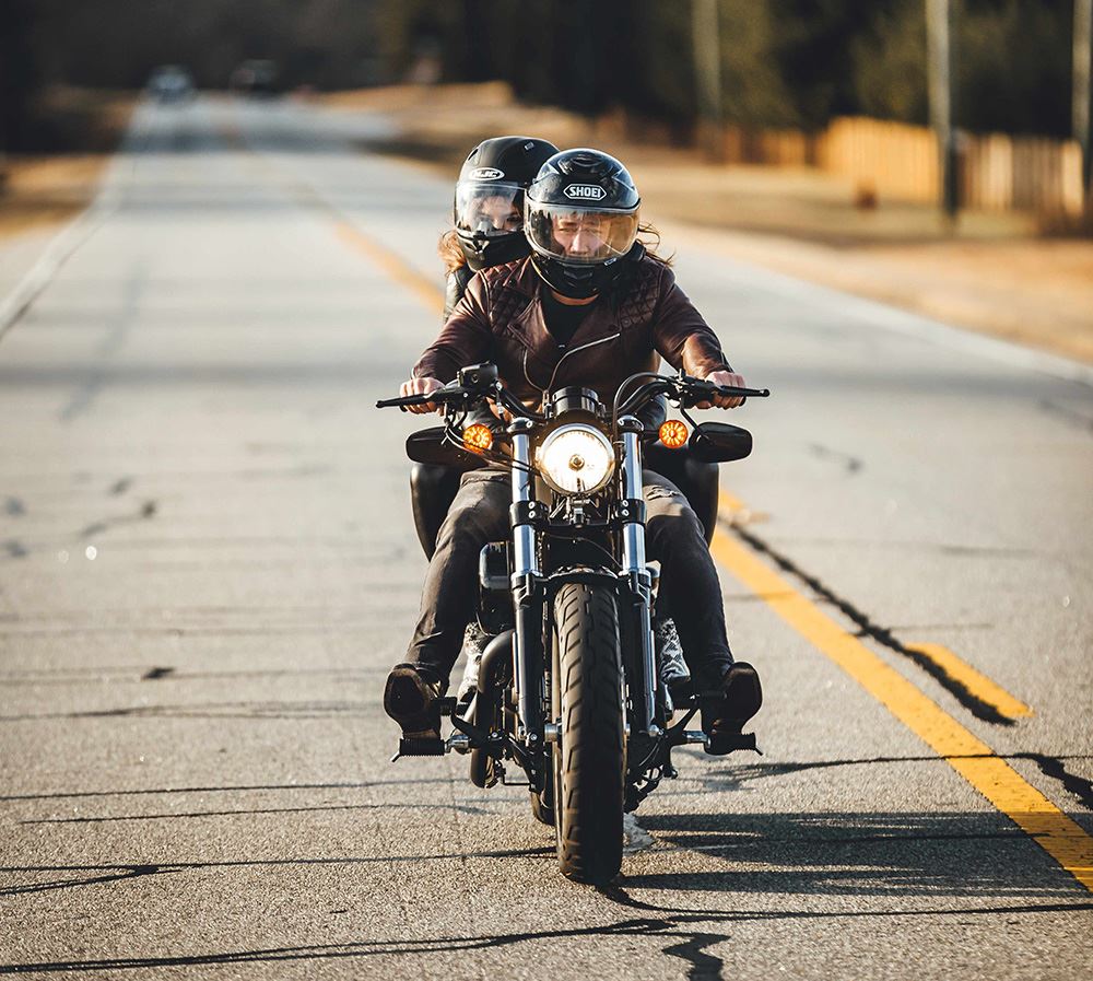 Couple riding on motorcycle